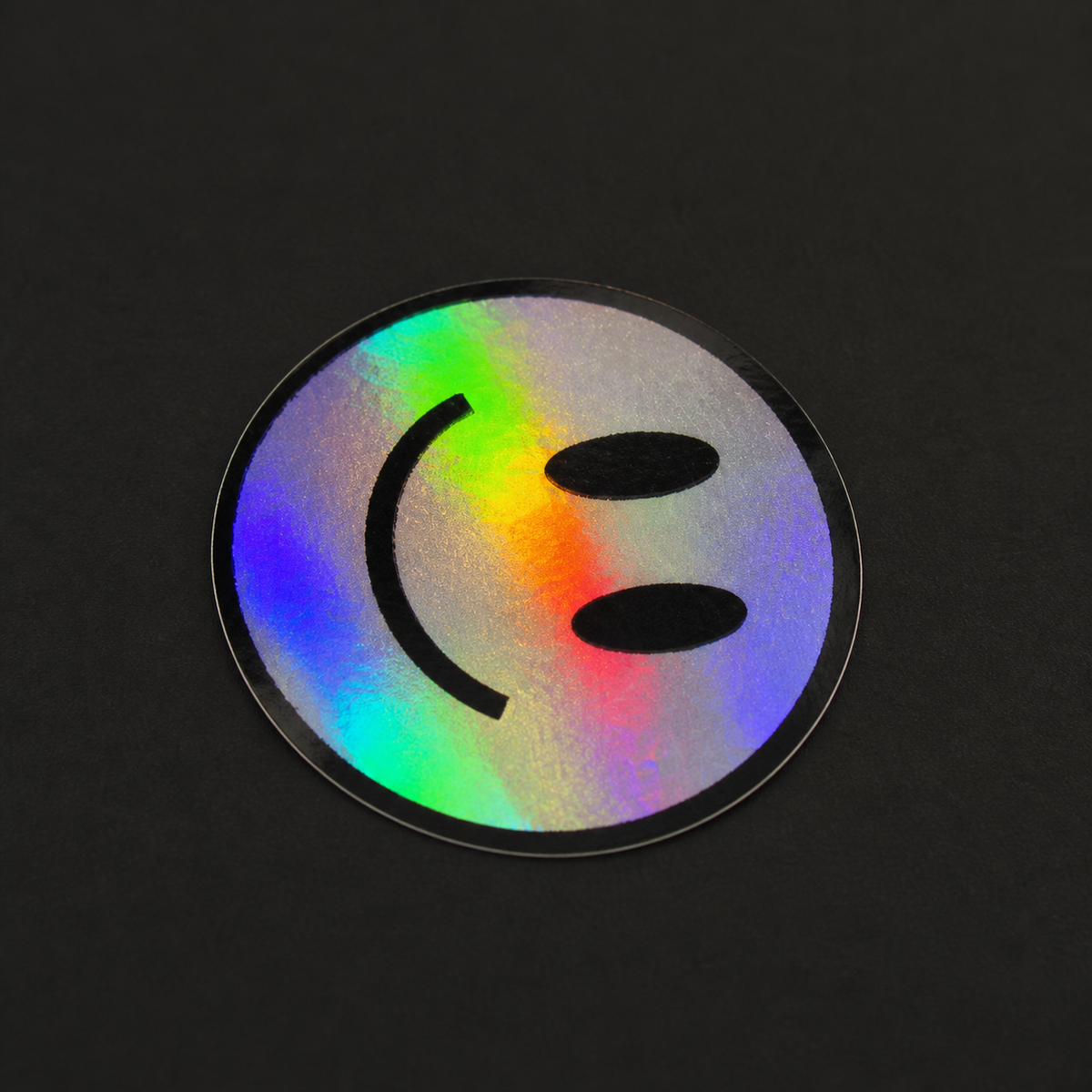 Real printed and contour-cut 75 mm rainbow holographic smiley sticker