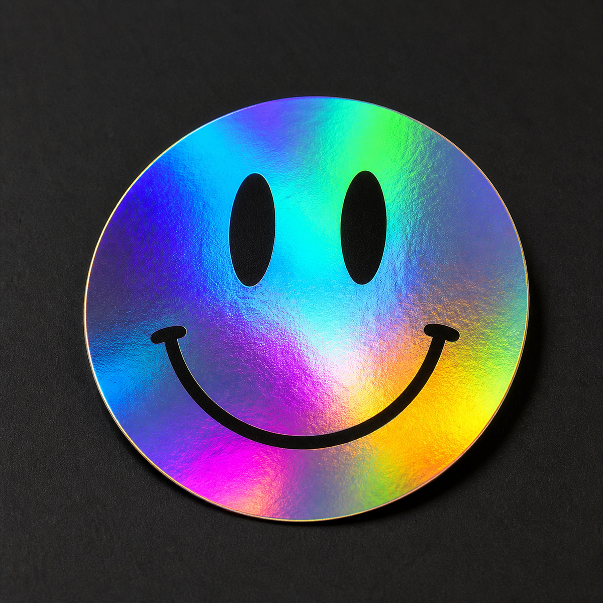 Rainbow silver holographic smiley face sticker with bold black print